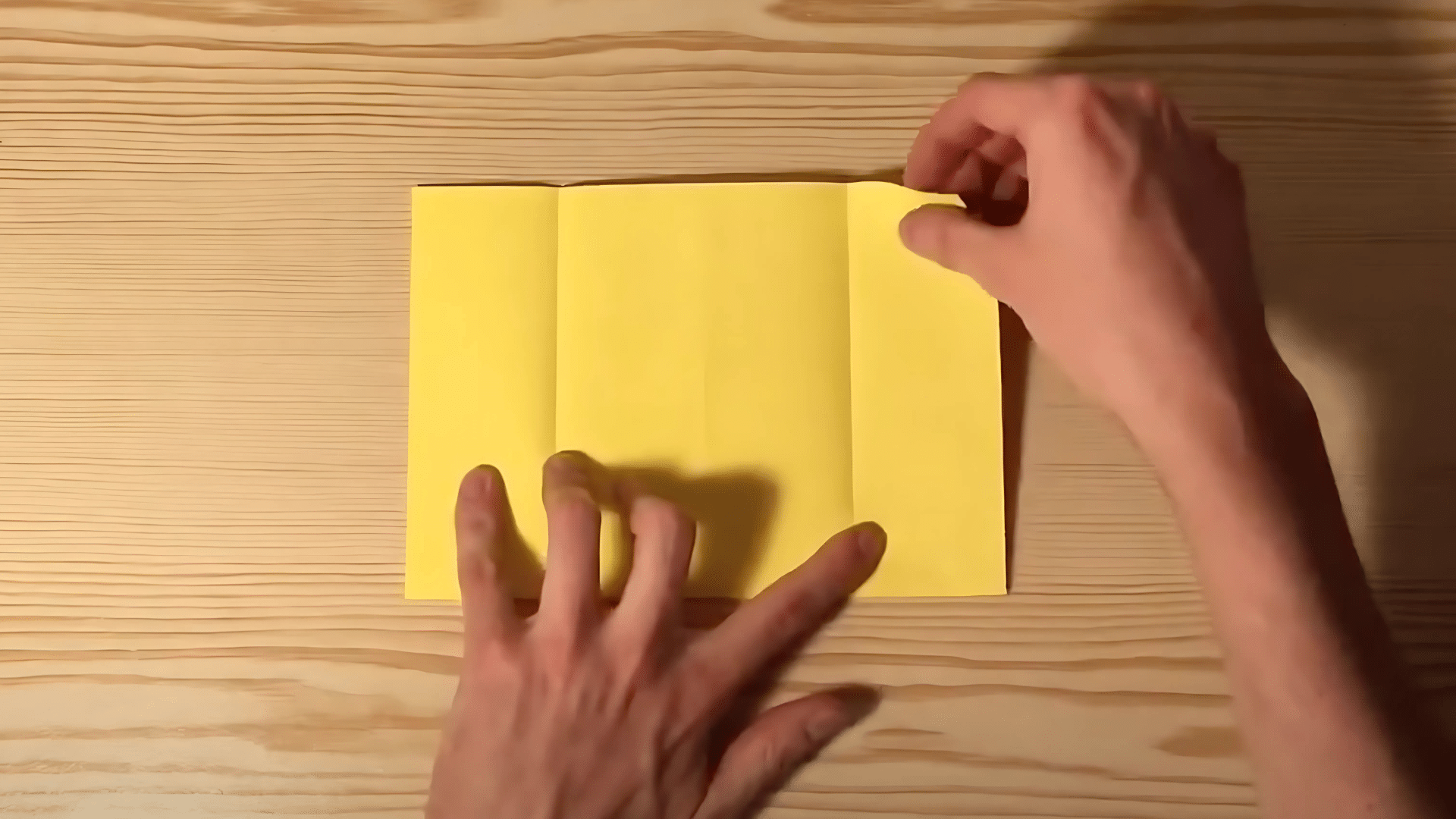 Carefully_bring_both_the_left_and_right_edges_and_fold_them_inward_to_meet_at_the_center_line