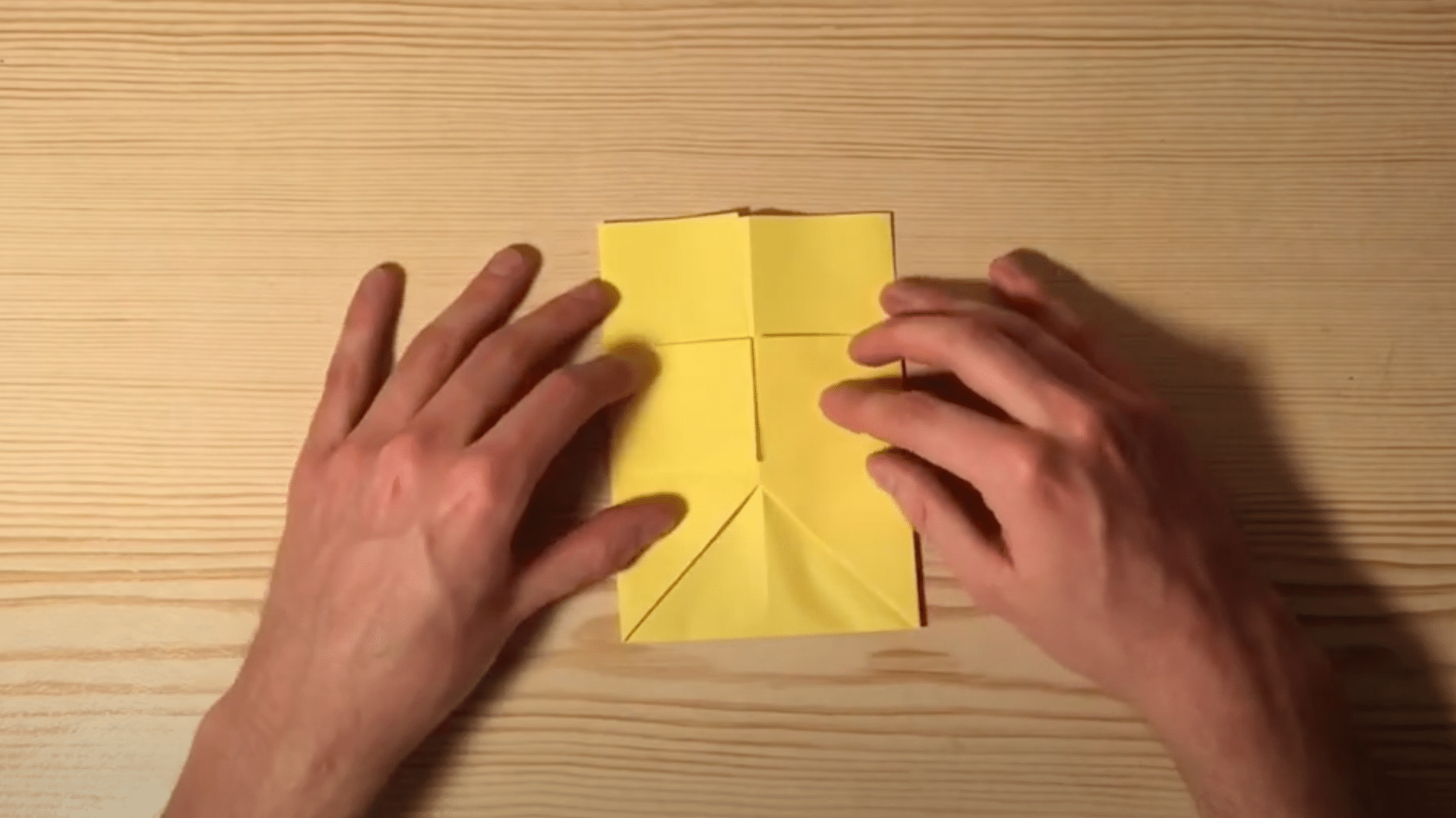 Find_the_bottom_corners_of_your_paper_and_fold_them_upward_until_they_touch_the_fold_lines